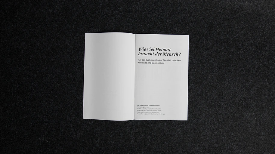 Opening title spread: ‘Wie viel Heimat braucht der Mensch?’ set in a serif on warm white paper.